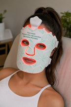 Cozy lifestyle shot of the glowing Lumora LED mask