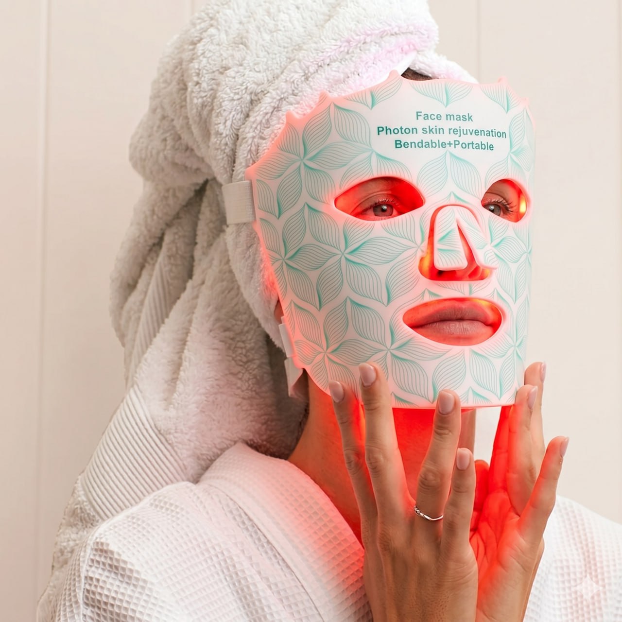Relaxing in a robe wearing the glowing Lumora LED mask