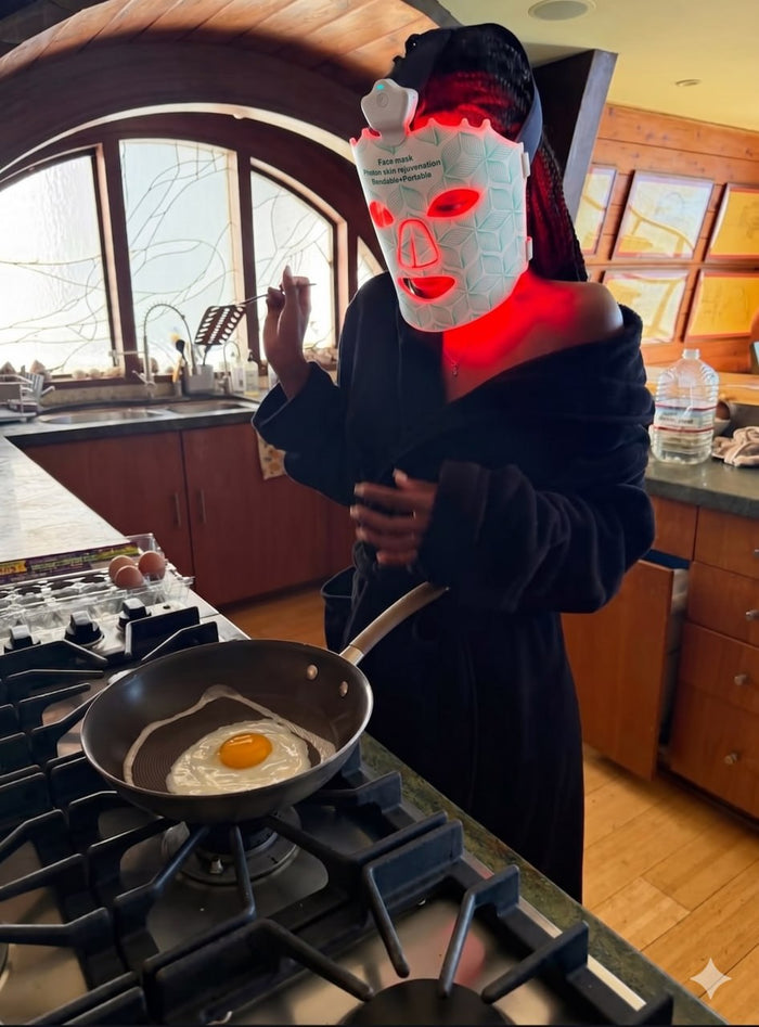 Glowing in the Lumora LED mask while cooking breakfast